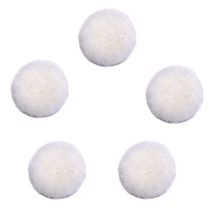 Five white round buffing pads shown in an assortment