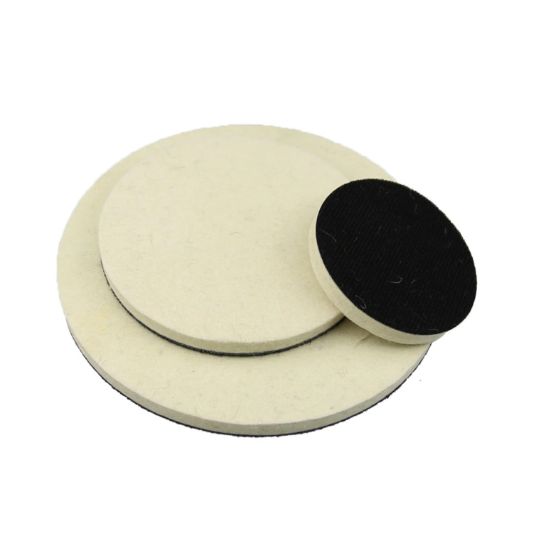 Flat beige felt polishing discs with one dark attachment side visible