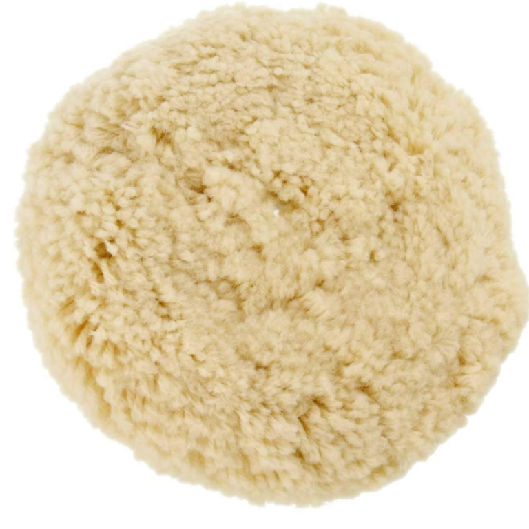 Cream-colored wool buffing pad shown from the working face