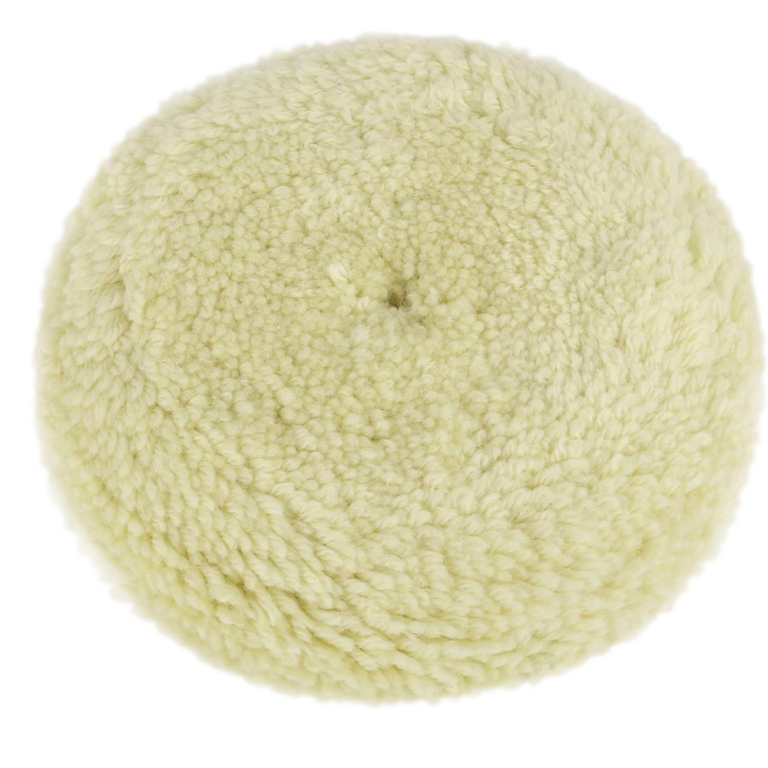 Cream-colored round wool buffing pad with a small center opening