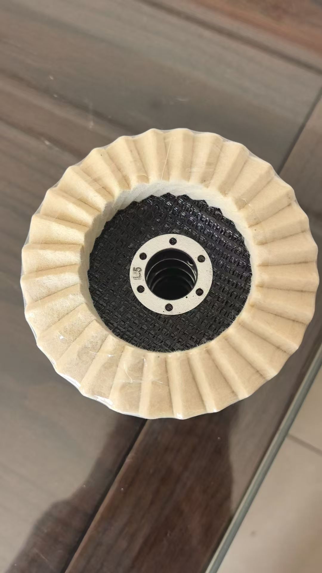 Felt flap polishing discs showing backing and centre openings